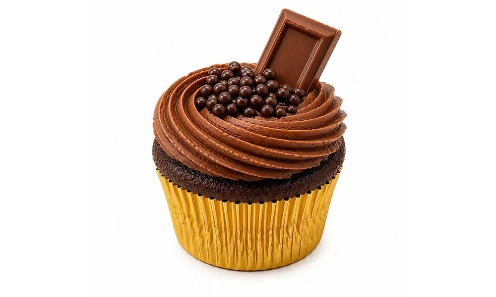 Chocolate cupcake with swirled cocoa frosting, crunch pearls and milk chocolate square garnish at Sweet Cottage Cafe, a Dessert shop in Lexington